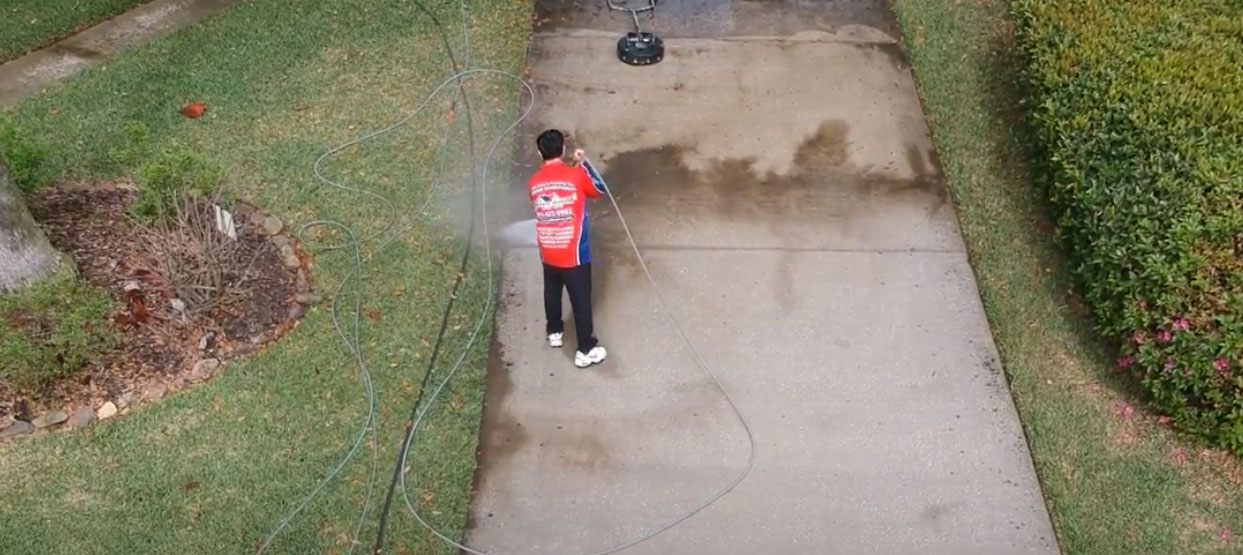 Ponte Vedra Wash Pros cleaning driveway with a wand